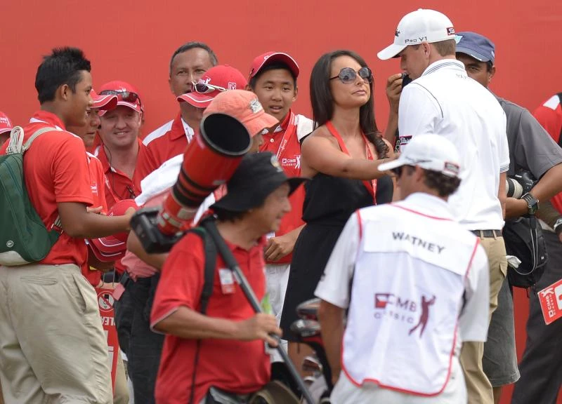 Malaysian heat gives winner’s wife a caddie shock