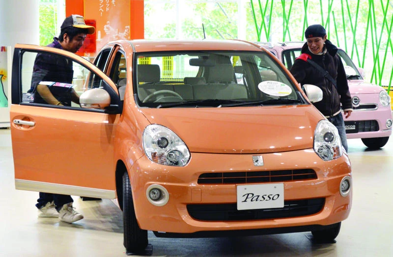 Toyota quarterly profit triples, raises forecast
