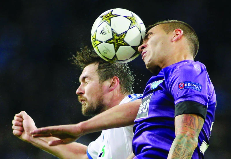 Porto, Malaga advance to Champions League last 16