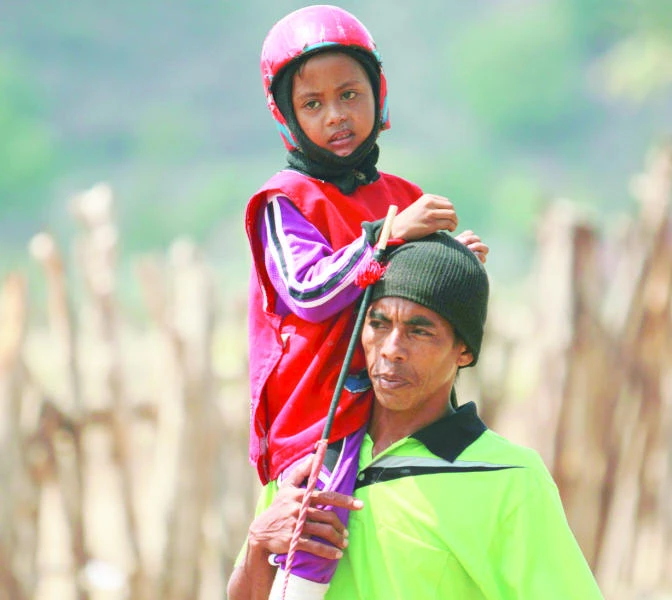 Indonesia’s child jockeys brave danger for cash and glory
