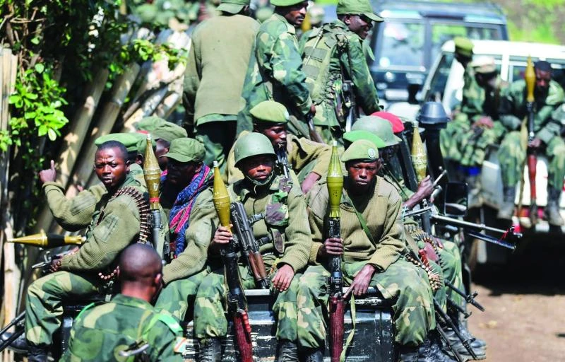 Congo rebels dig in around Goma as leader heads for talks
