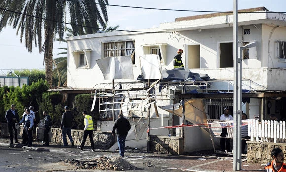 Israel warns of tough response after Gaza rocket hits house