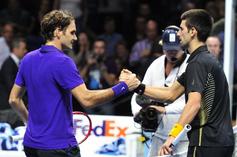 Djokovic grinds down Federer to win season finale