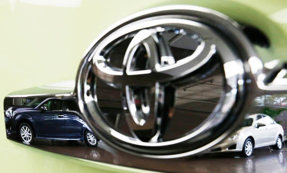 Toyota quarterly profit triples, raises forecast