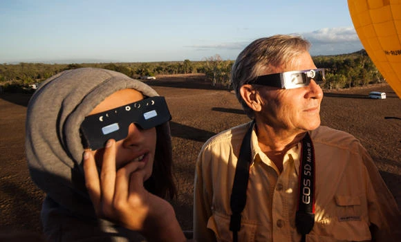 Clouds part, solar eclipse darkens north Australia