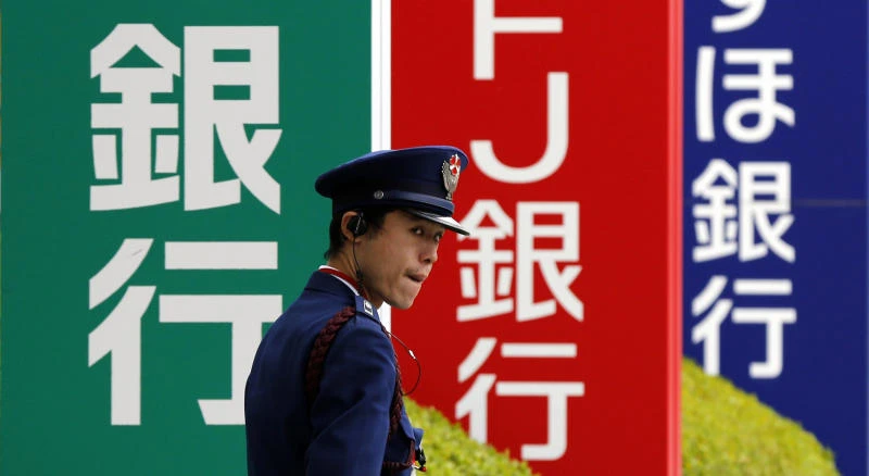 Japan’s biggest bank reports 58% profit tumble