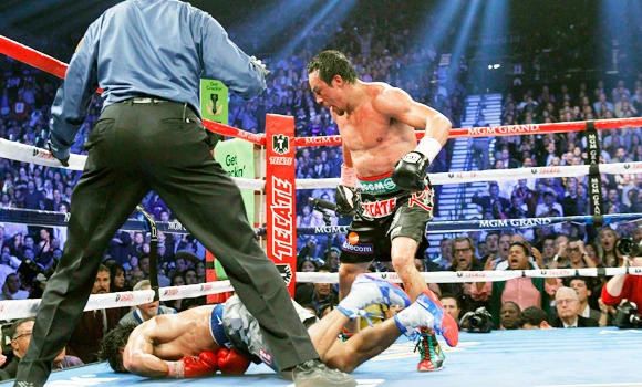 Bloodied Marquez knocks out Pacquiao in sixth