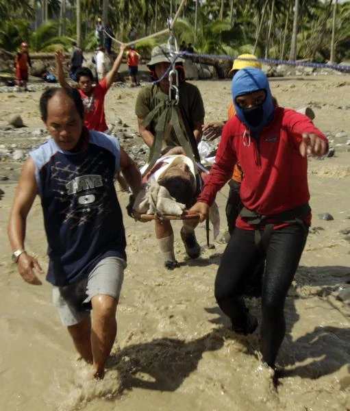 Manila typhoon quietens rebels; toll 477