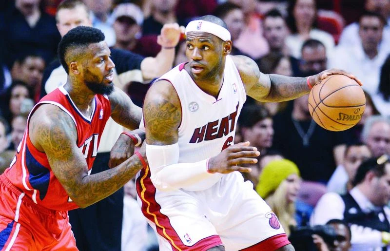 James, Wade star as Heat down Hawks