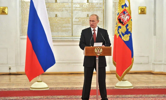 Putin urges unity after year of protests