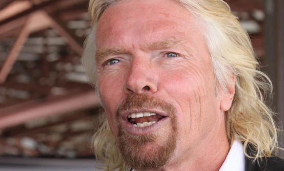 Branson to be AirAsia stewardess after losing GP bet