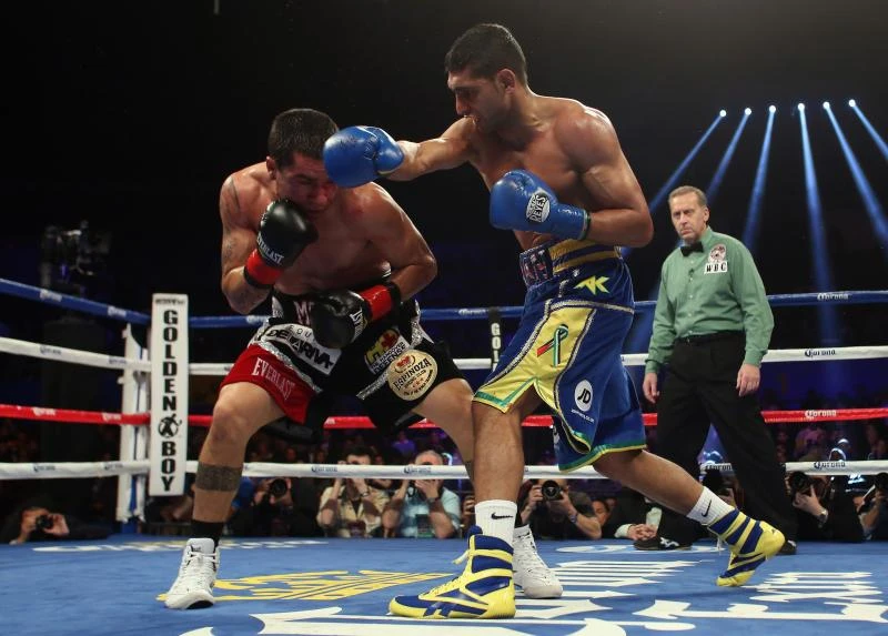 Amir Khan stops Carlos Molina in comeback fight