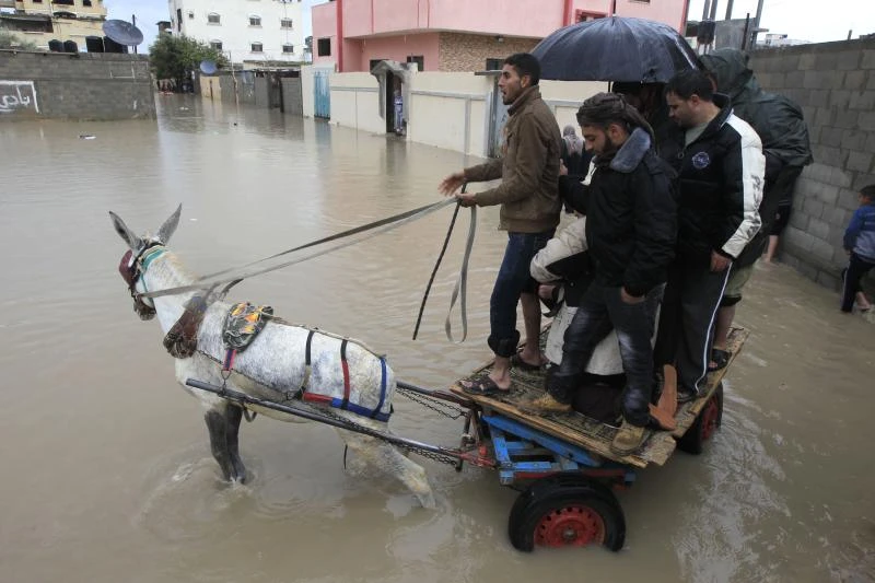 9 dead as hail, snow and rain batter Mideast