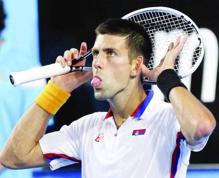 Djokovic dodges injury as Serbia thrashes Italy