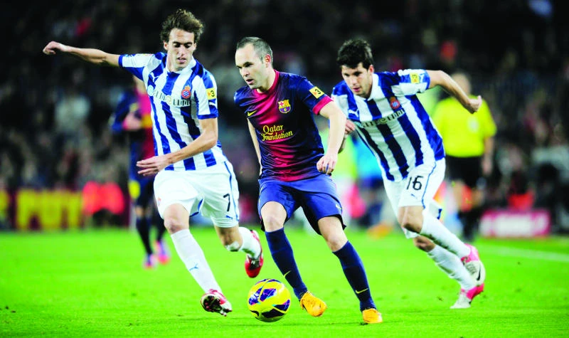 Barca routs Espanyol to move 11 points clear at the top