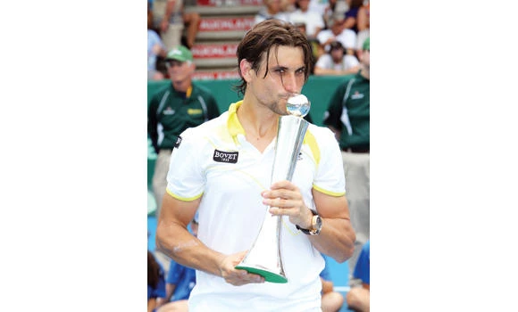 Tomic, Hewitt give locals hope; Ferrer wins