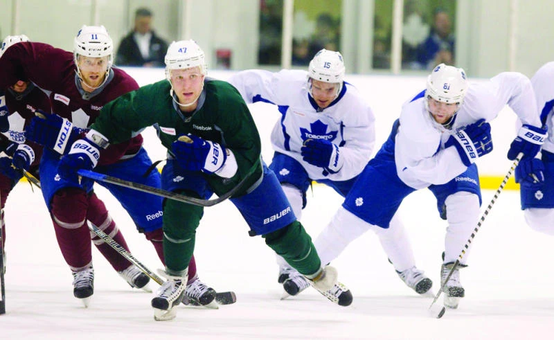 NHL players back to work as training camps open