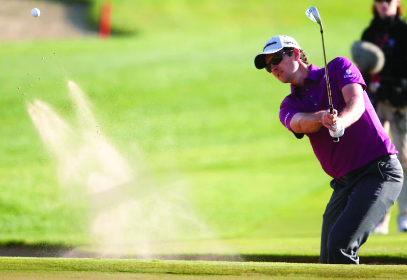 Rose blooms; McIlroy, Woods struggle in Abu Dhabi