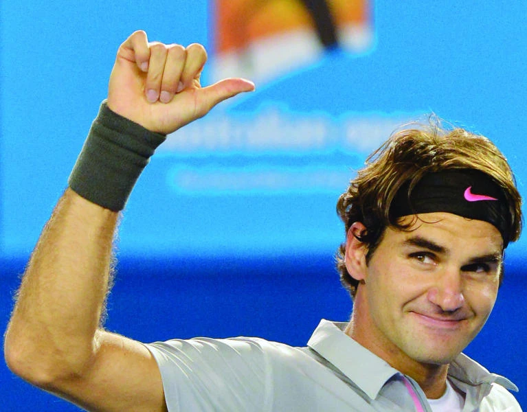 Federer, Serena storm into quarters