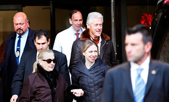 Clinton back home after treatment for clot