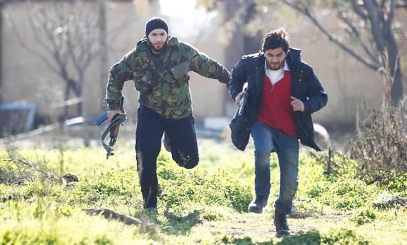 Syria air raid kills 12 in one family, clashes in northwest