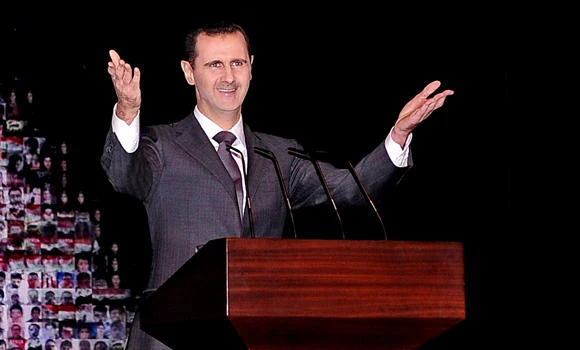 Assad to run for 2014 election; 15 killed in air raids