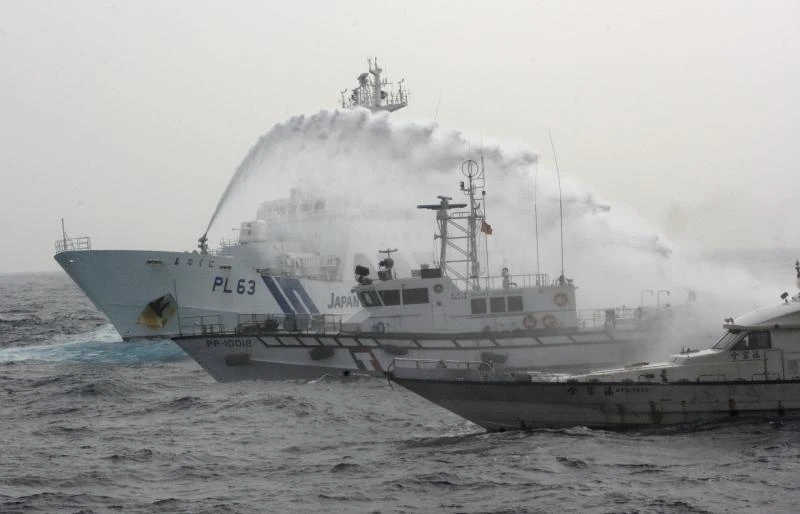 China ships watch as Taiwan, Japan vessels duel over islets