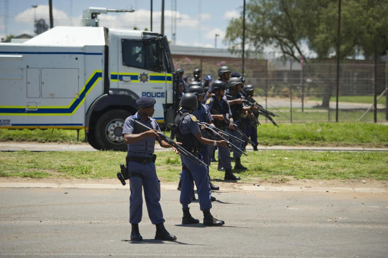 S. Africa police raid riot-hit shantytown