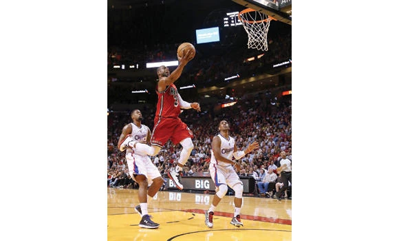 James, Heat cruise past Clippers