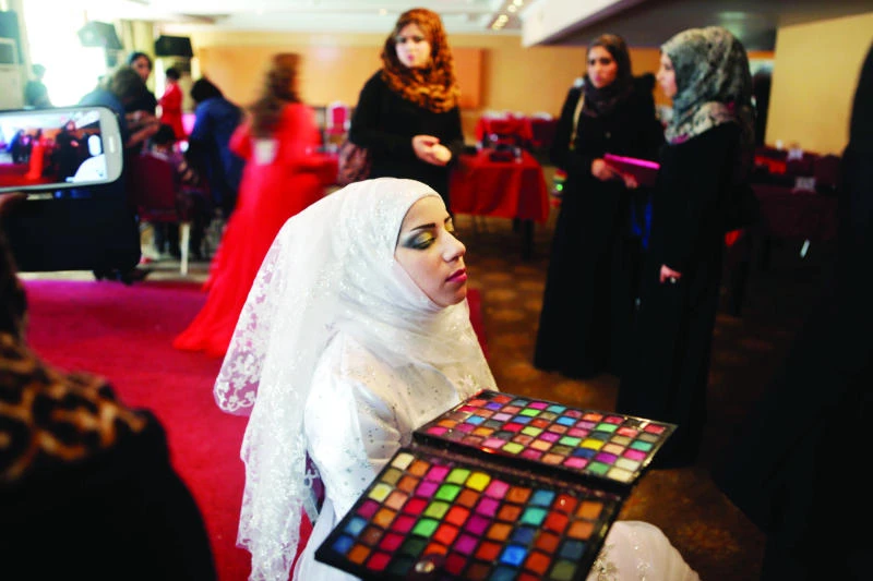 Iraqi beauticians, hairdressers conquer fear at Baghdad festival