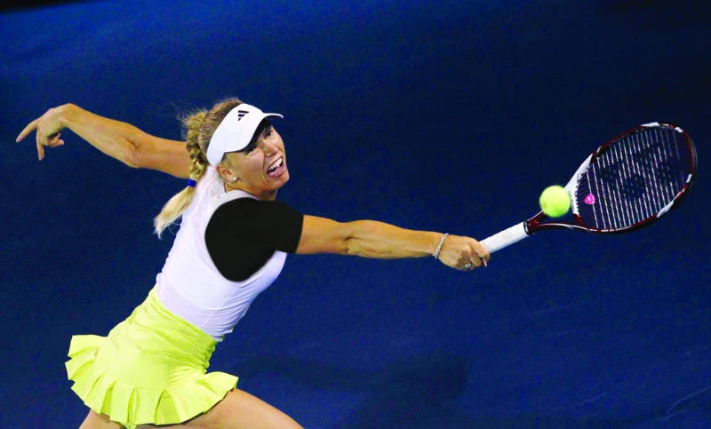 Wozniacki eases through in Dubai; Azarenka pulls out