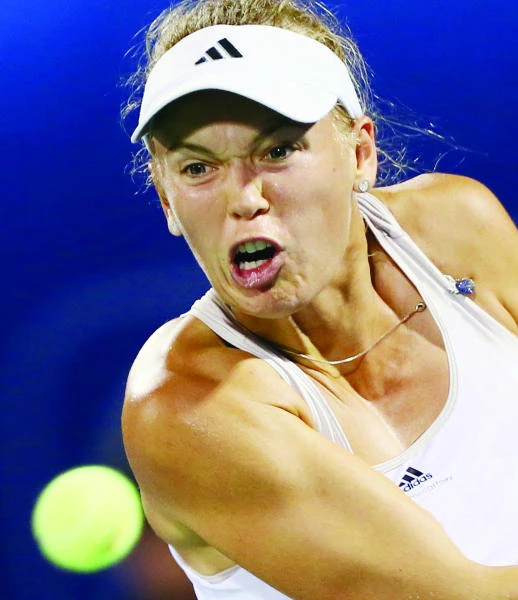 Wozniacki struggles into semis