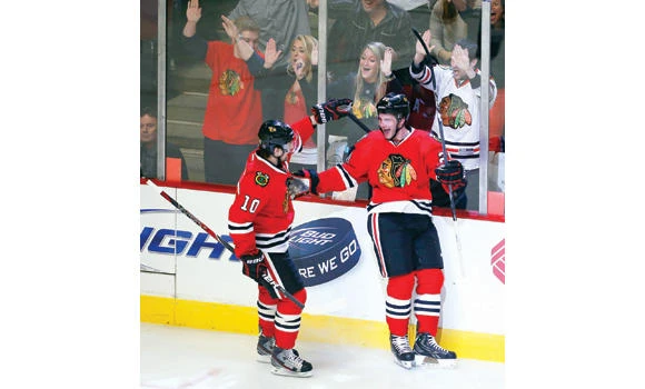 Blackhawks set NHL record with 2-1 victory over Sharks