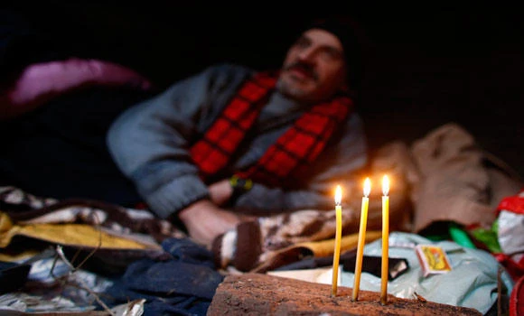 Homeless Serbian man moves into grave