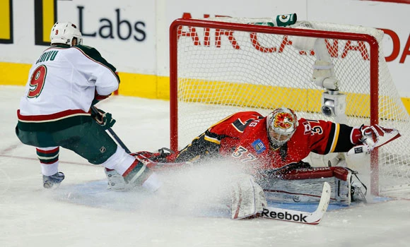 Wild slip past Flames in shootout