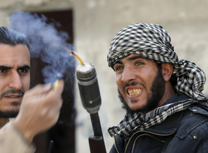 Amid deadly air raids, Assad shuffles Cabinet
