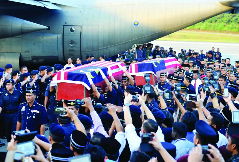 Manila urges tolerance as troops rushed to Sabah