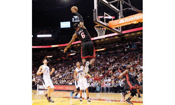 LeBron’s late basket powers Heat to 16th straight win