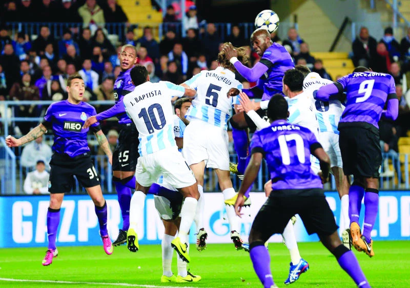 Arsenal bows out in style; Malaga extends dream run