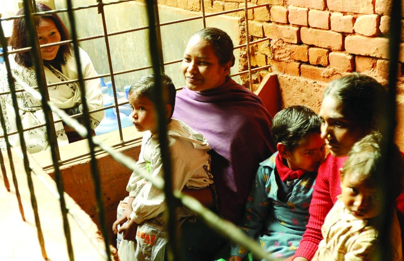 Nepal mother rescuing children from behind bars