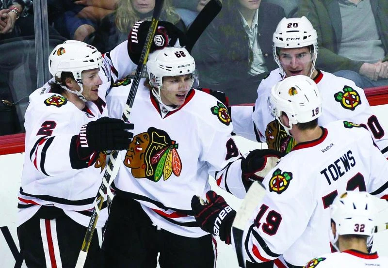 Emery stops 17 shots, Kane has goal and 2 assists in Chicago victory
