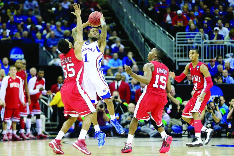 No. 1 Kansas dodges Western Kentucky upset ax
