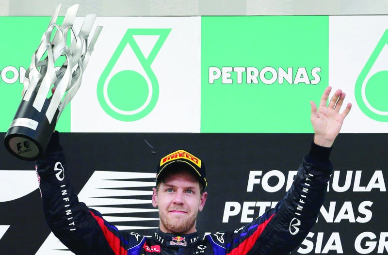 Vettel snatches controversial win from Webber