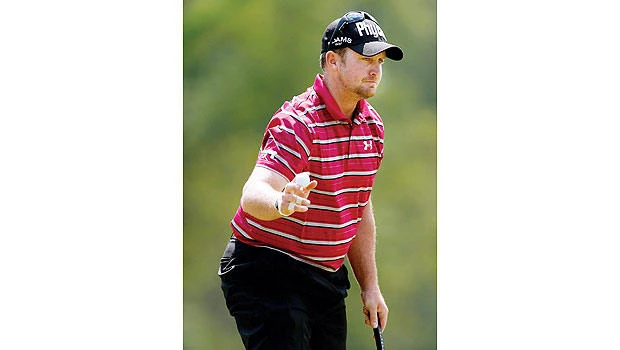 Qualifier Wheatcroft leads as McIlroy barely makes cut