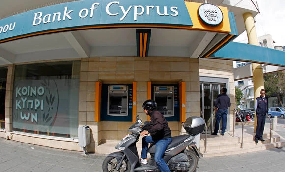 Cyprus banks reopen; limits on transactions