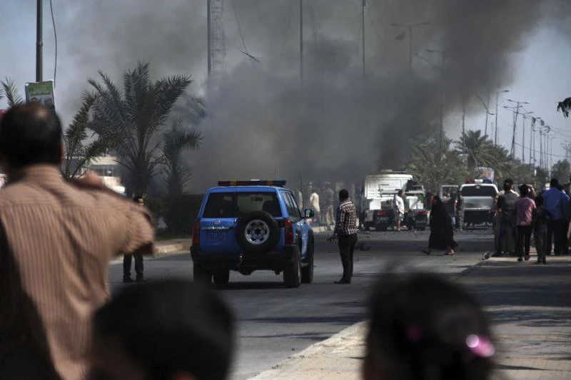 Blasts kill 57 decade after Iraq invasion