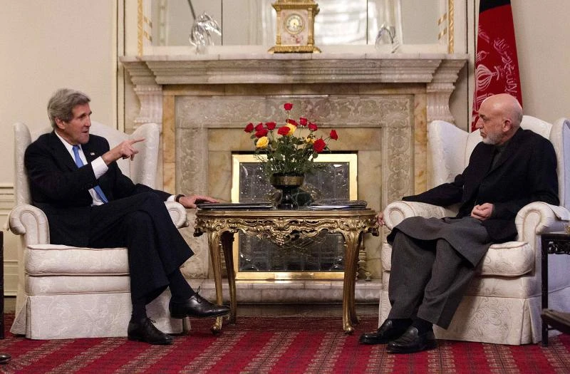 Kerry in Afghanistan to prod Karzai on future ties