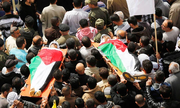Funerals draw thousands in tense W. Bank