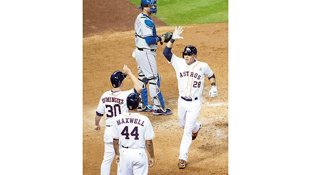 Astros strong in AL debut, trounce Rangers 8-2