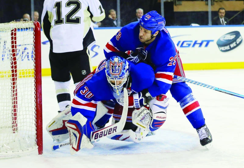 Clowe, Brassard power Rangers to rout of Penguins